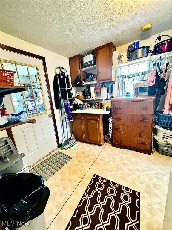 kitchen featuring a textured ceiling