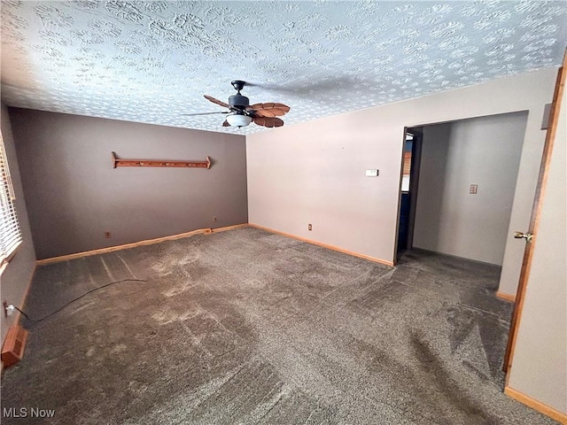 carpeted empty room featuring a textured ceiling and ceiling fan