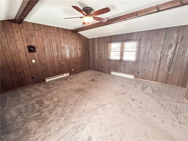 carpeted spare room featuring beamed ceiling, baseboard heating, and wood walls