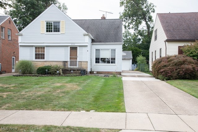 view of front of house with a garage and a front yard