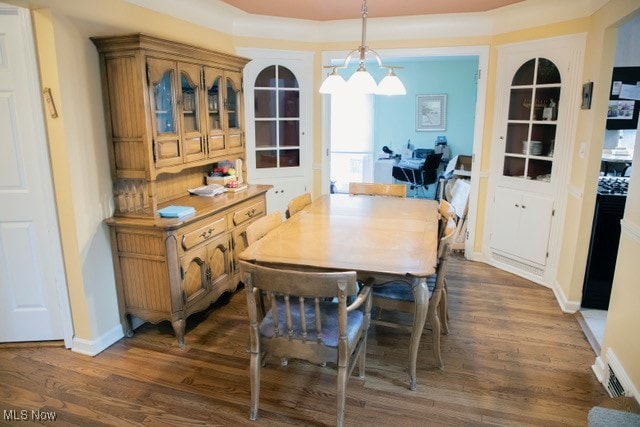 dining room with dark hardwood / wood-style floors