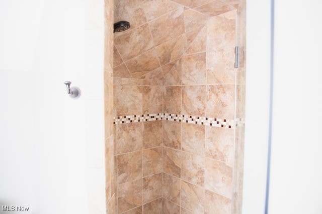 bathroom with a shower with shower door