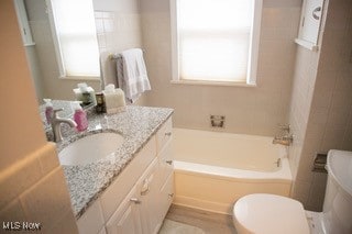 bathroom with toilet and vanity