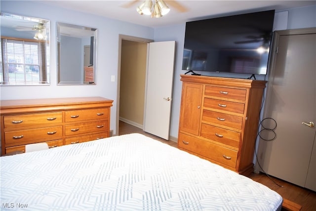 bedroom with light wood-type flooring and ceiling fan