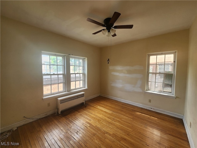 empty room featuring light hardwood / wood-style floors and ceiling fan