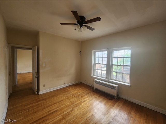 unfurnished room with light hardwood / wood-style floors and ceiling fan