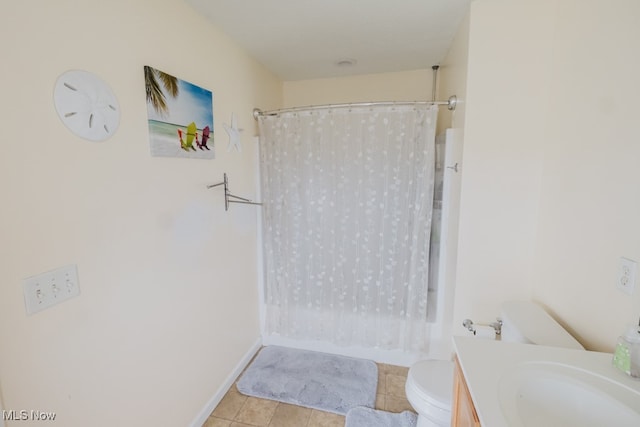 full bathroom featuring shower / bath combo with shower curtain, vanity, tile patterned floors, and toilet