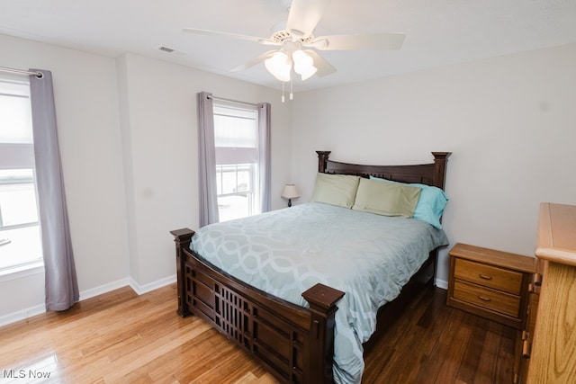 bedroom with ceiling fan and hardwood / wood-style floors