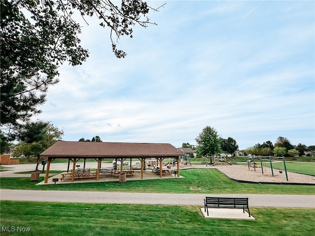 surrounding community featuring a playground, a gazebo, and a lawn