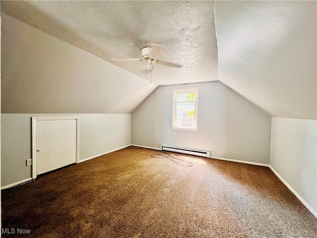 bonus room featuring ceiling fan, carpet flooring, a textured ceiling, baseboard heating, and vaulted ceiling