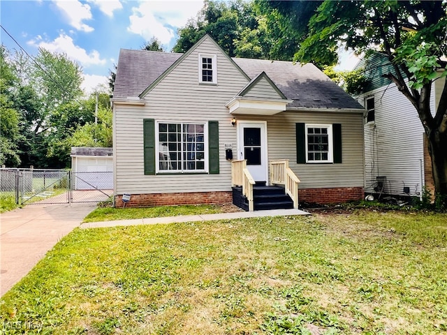 view of front of property with a front yard and a garage