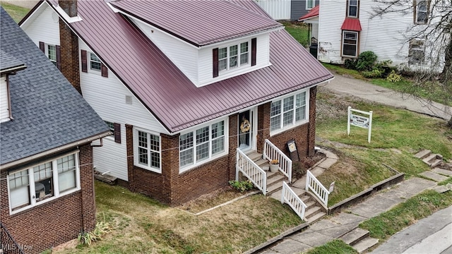 back of house with a lawn