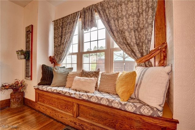 sitting room with hardwood / wood-style flooring