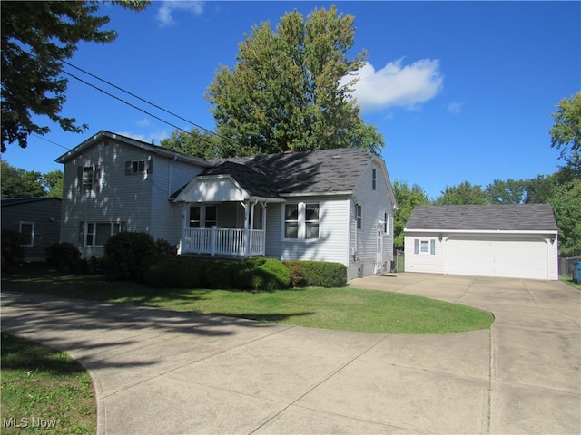 view of front of house featuring a garage, a porch, and a front lawn