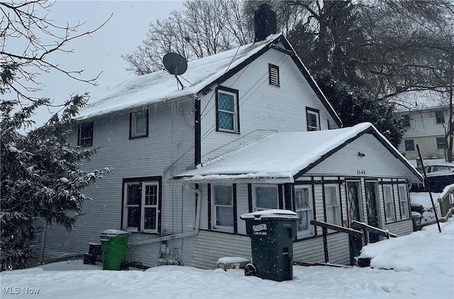 view of snow covered house