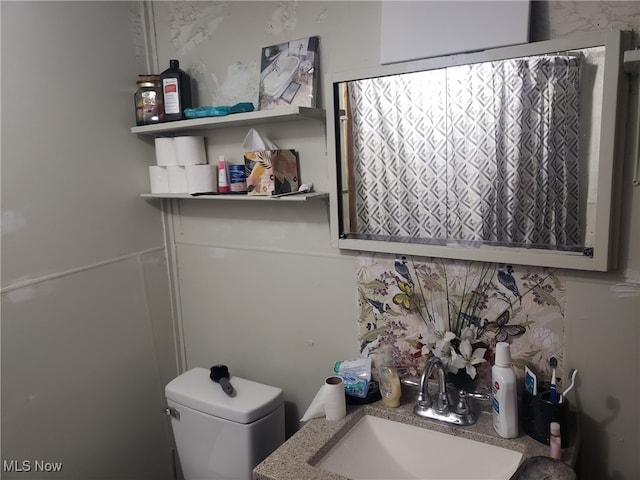 bathroom featuring sink and toilet