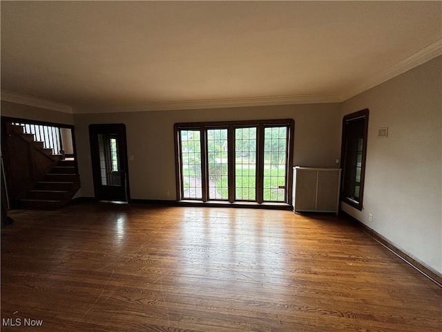 interior space featuring dark wood-type flooring and crown molding