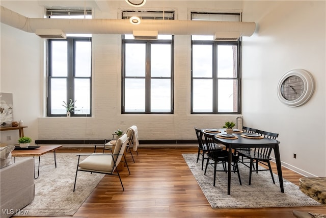 dining area featuring plenty of natural light and hardwood / wood-style floors