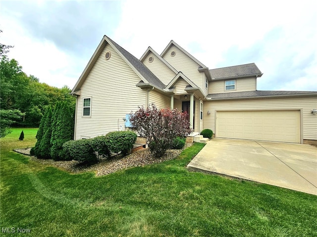 view of front of property featuring a front yard and a garage