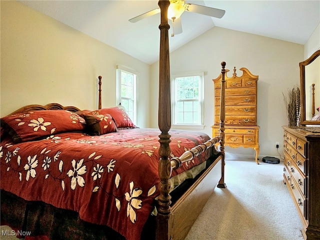 carpeted bedroom featuring ceiling fan and vaulted ceiling