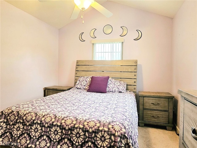 bedroom featuring lofted ceiling, ceiling fan, and light carpet