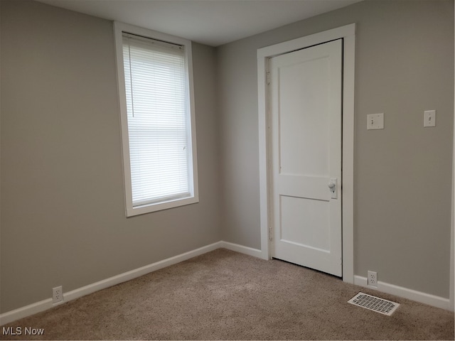 view of carpeted spare room