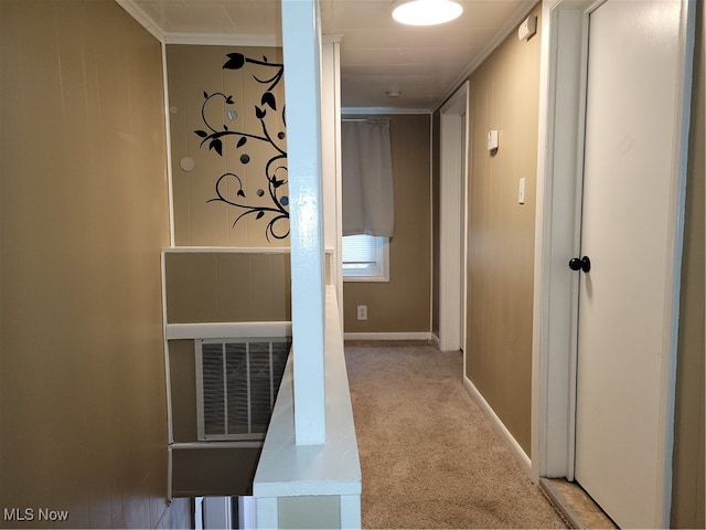 hall featuring light carpet and ornamental molding