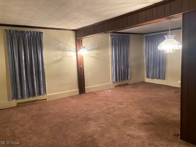 empty room with carpet floors and ornamental molding