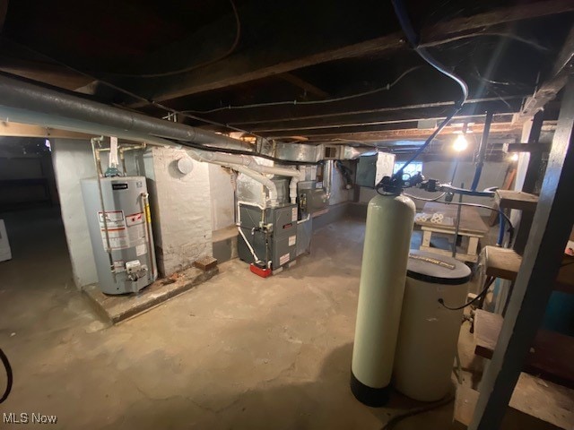 basement with heating unit and water heater