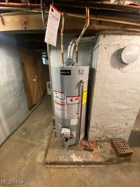 utility room with gas water heater