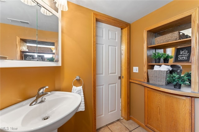 bathroom featuring tile patterned flooring and sink