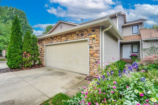 view of side of property with a garage