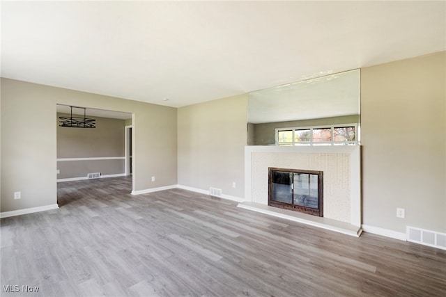 unfurnished living room featuring light hardwood / wood-style floors