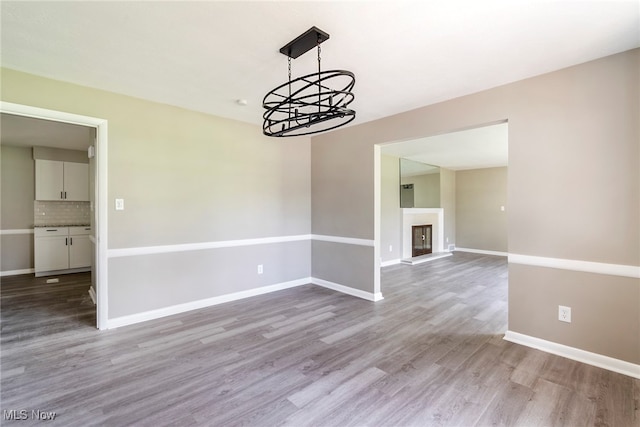 spare room with light wood-type flooring