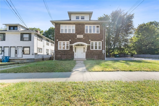 view of front of property with a front lawn