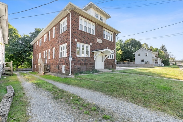 view of front of property with a front lawn