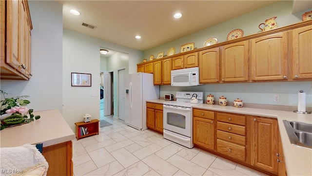 kitchen featuring white appliances