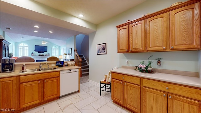 kitchen with vaulted ceiling, dishwasher, ceiling fan, and sink