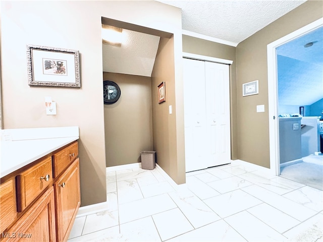 bathroom featuring vanity and a textured ceiling