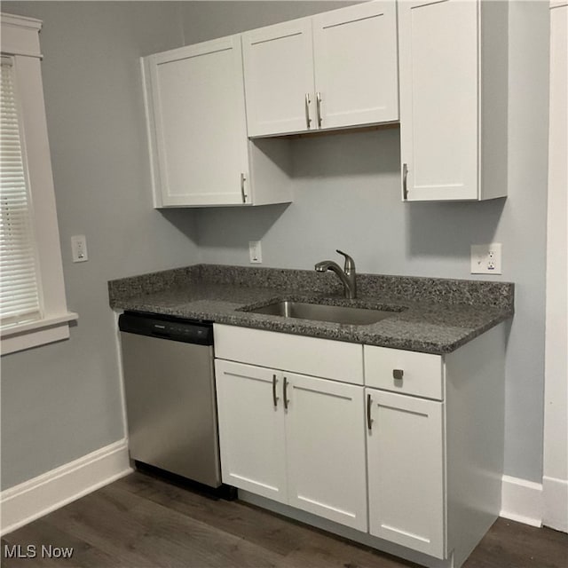 kitchen featuring dishwasher, dark hardwood / wood-style floors, sink, and white cabinetry