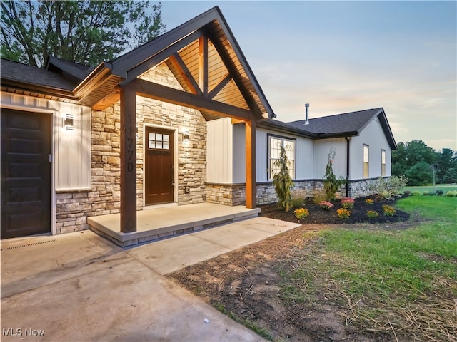 exterior entry at dusk with a garage