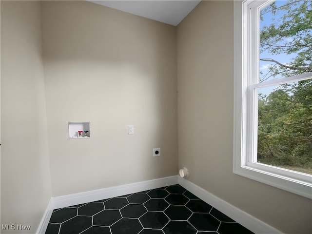 laundry room with hookup for an electric dryer, washer hookup, and tile patterned floors