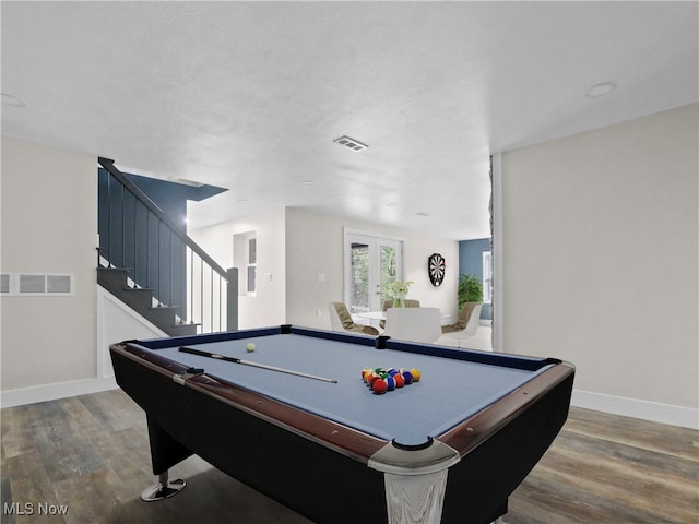 game room with pool table, french doors, and hardwood / wood-style flooring