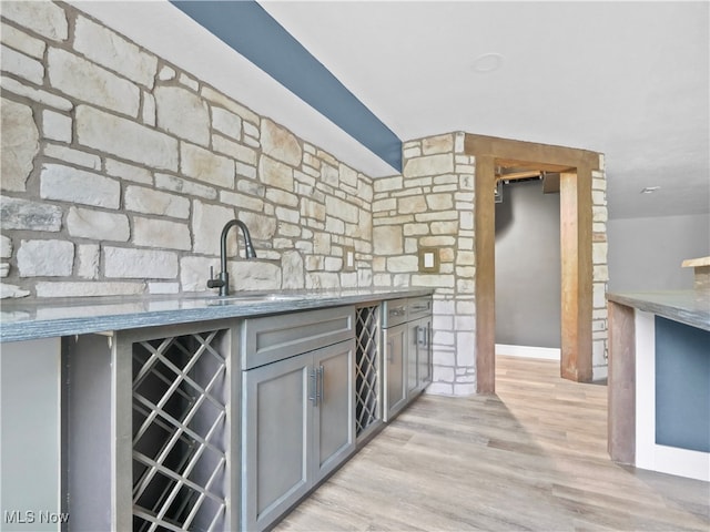 kitchen featuring gray cabinetry, sink, wine cooler, and light hardwood / wood-style flooring