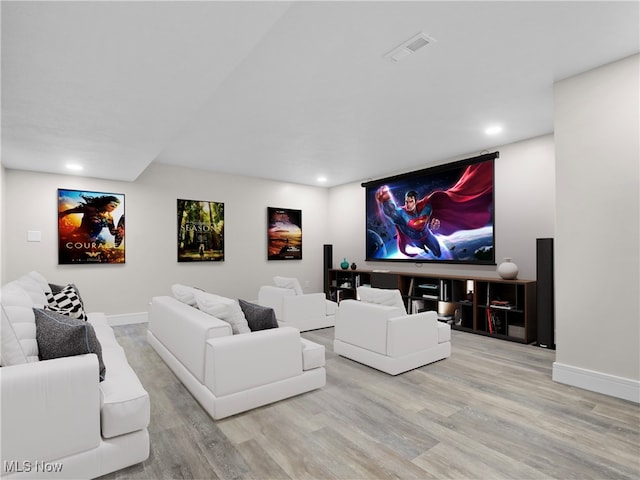 home theater room with light hardwood / wood-style floors