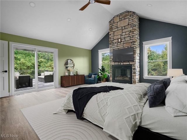 bedroom with ceiling fan, access to outside, and multiple windows