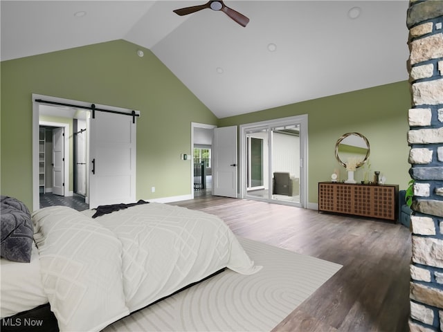 bedroom with dark hardwood / wood-style flooring, a barn door, ceiling fan, and lofted ceiling