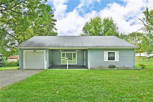 ranch-style home with a front yard and a garage