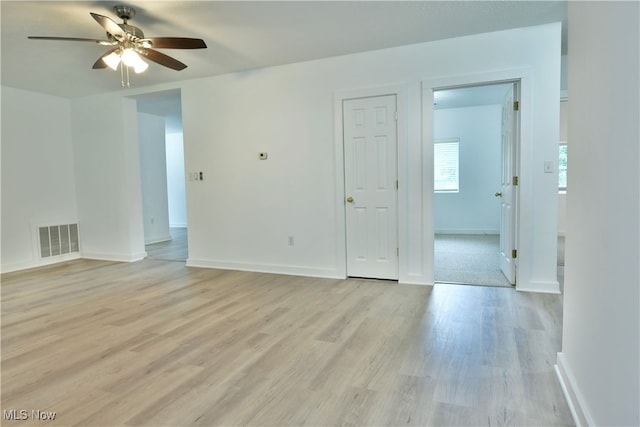 empty room featuring light hardwood / wood-style floors and ceiling fan