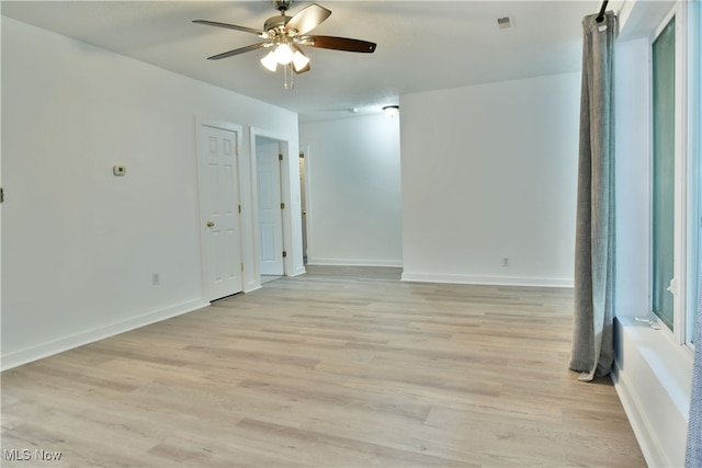 spare room featuring light hardwood / wood-style floors and ceiling fan